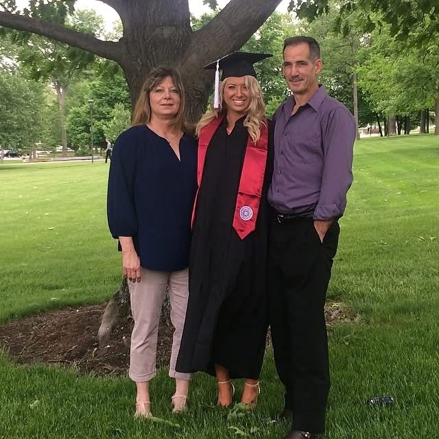 Charles Willis with his wife and daughter at her college graduation