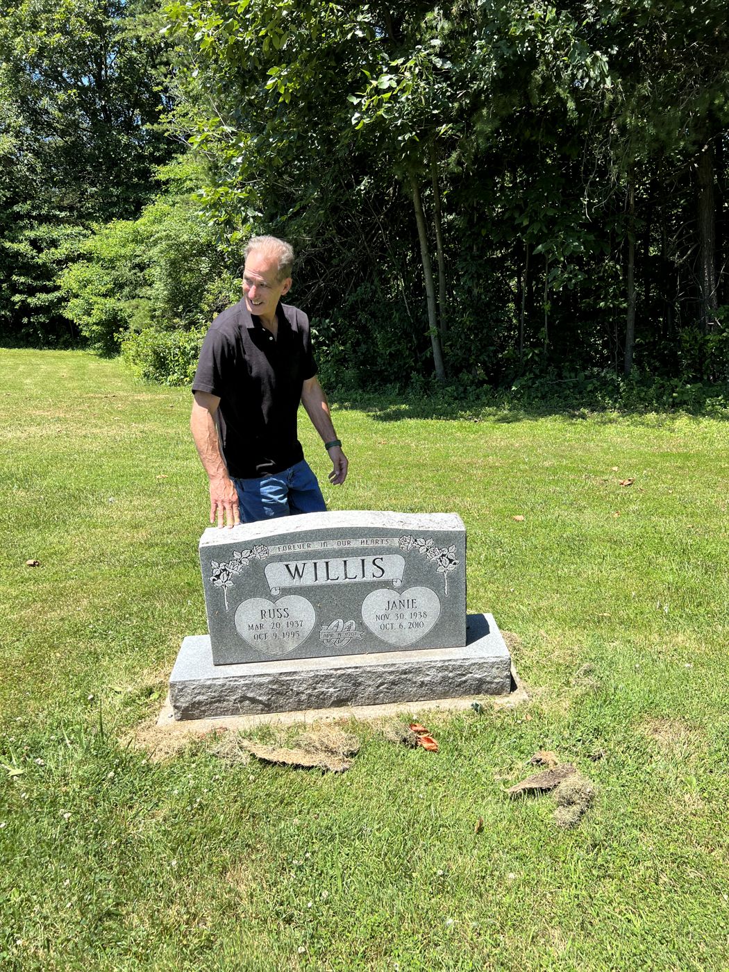 Charles visiting his parents' gravesite, the Willis family headstone